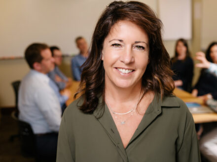 Jennifer-Briggs Jennifer Briggs professional headshot, smiling in classroom setting