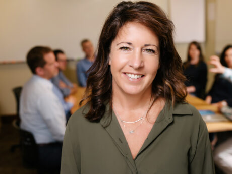 Jennifer Briggs professional headshot, smiling in classroom setting